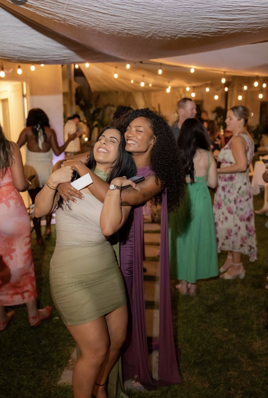 Jazmine Farmer (in purple) hugging Mehr